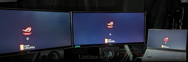 Zephyrus laptop booting Ubuntu while connected to two ultrawide LC monitors.